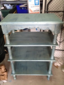 Small shelves with blue base and metallic green glaze
