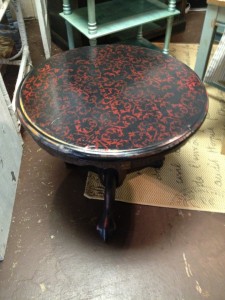 Distressed black with red stencil and high gloss.